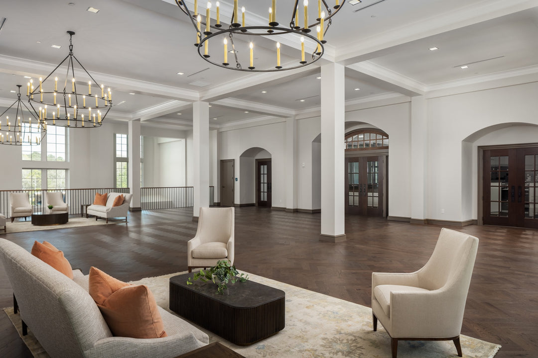 Herringbone wood flooring installed in a commercial gathering space